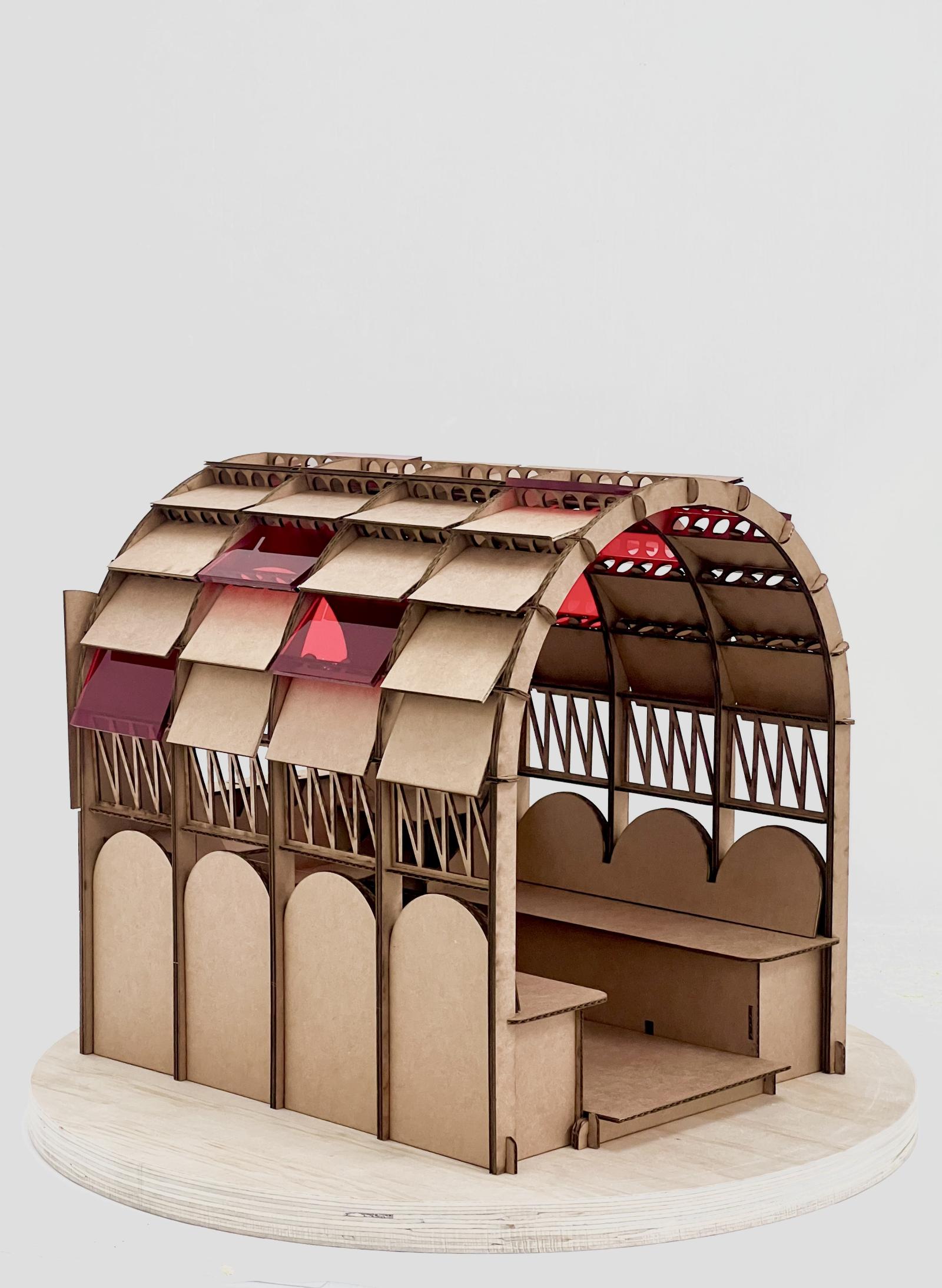 Drift.2 ; 1:10 ; fabrication and assembly models

These models were developed to test the design, fabrication and assembly of DRIFT.2, a pop-up audio studio for Drift Radio commissioned by Super Slow Way. The mobile structure reimagines a previous radio studio retrofitted within the Bill Hunt barge, and has been travelling across Lancashire, providing space for recording, listening and small gatherings. Designed to house technical equipment and seating for four people, the structure needed to be lightweight, easy to transport and capable of being dismantled and reassembled quickly by two people.
The first model is a hand-cut, early development study used to explore the overall form and spatial logic. The second is a lasercut prototype made directly from the fabrication files that were later scaled up for the construction of the full-sized structure. Together, the models reveal the iterative process of refining a modular, demountable system, allowing the collaborators and users to understand how the studio is assembled and how it functions.

Hand-cut and laser cut cardboard and perspex

Made by Sam Eadington, designer and modelmaker ; Lee Ivett and Ecaterina Stefanescu, designers ; University of Lancashire technical team, technical support