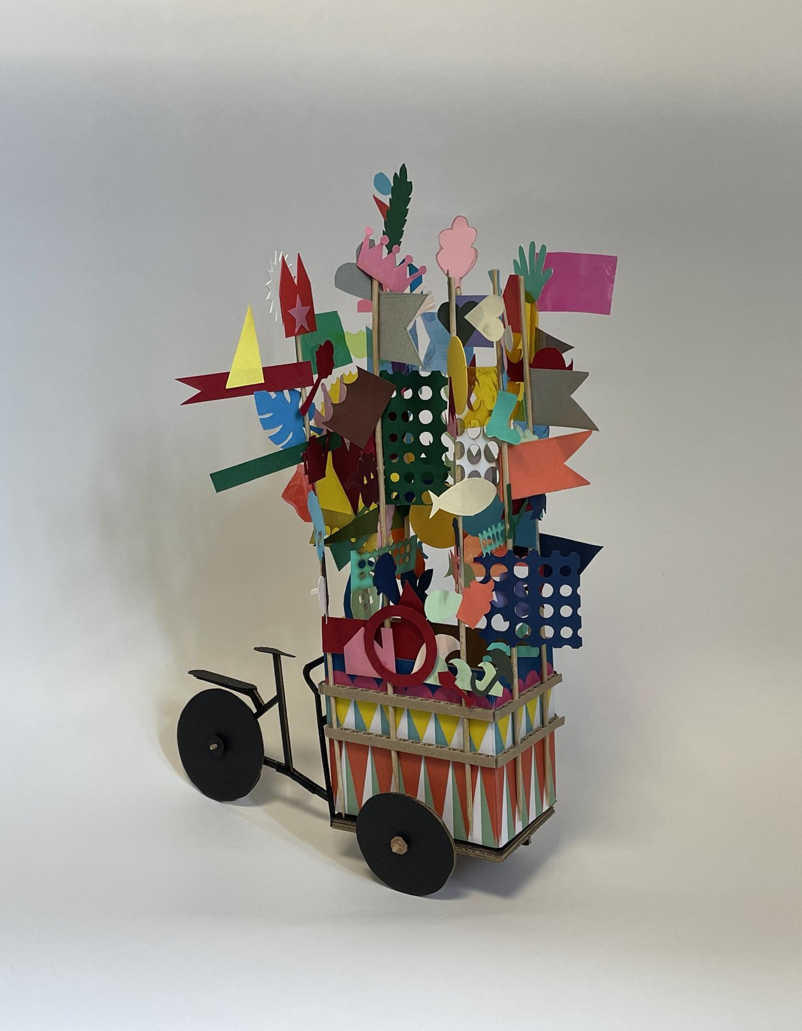 Grangetopia: The Illuminated Ice Cream Cart / 1:10 / participatory co-design model 

This model was developed for Grangetopia, a collaborative project with Grange Park residents from Blackpool and artist Samantha Jones for LeftCoast, exploring how the act of making with communities can open up conversations about identity, belonging and the right to happiness. The project focused on redesigning the community’s existing ice-cream tricycle for the 2024 Lightpool Festival, transforming it into an illuminated mobile installation serving vegan apple ice cream made from the estate’s own orchards.
The scale model played a central role during the initial workshops at The Grange community centre, where residents used collaging and modelmaking to imagine how the cart could reflect their stories, ideas of belonging and ambitions. The quick, sketchy and interactive nature of the hand-made model allowed the participants to test ideas for how the cart would be adapted, decorated, and lit up. The model also helped guide technical discussions with Lightworks, whose team repurposed recycled neon elements from the Blackpool Illuminations for the final build.
Beyond informing the festival installation, the model and project became a catalyst for imagining a future community-led social enterprise, connecting Blackpool’s beach economy to Grange Park. Through making at scale, residents were able to articulate a collective vision of “Grangetopia” grounded in pride, creativity and a taste of happiness.

Coloured paper, card, cardboard, bamboo sticks

Made by Ecaterina Stefanescu (model maker and designer) with artist Sam Jones and Grange Park, Blackpool residents