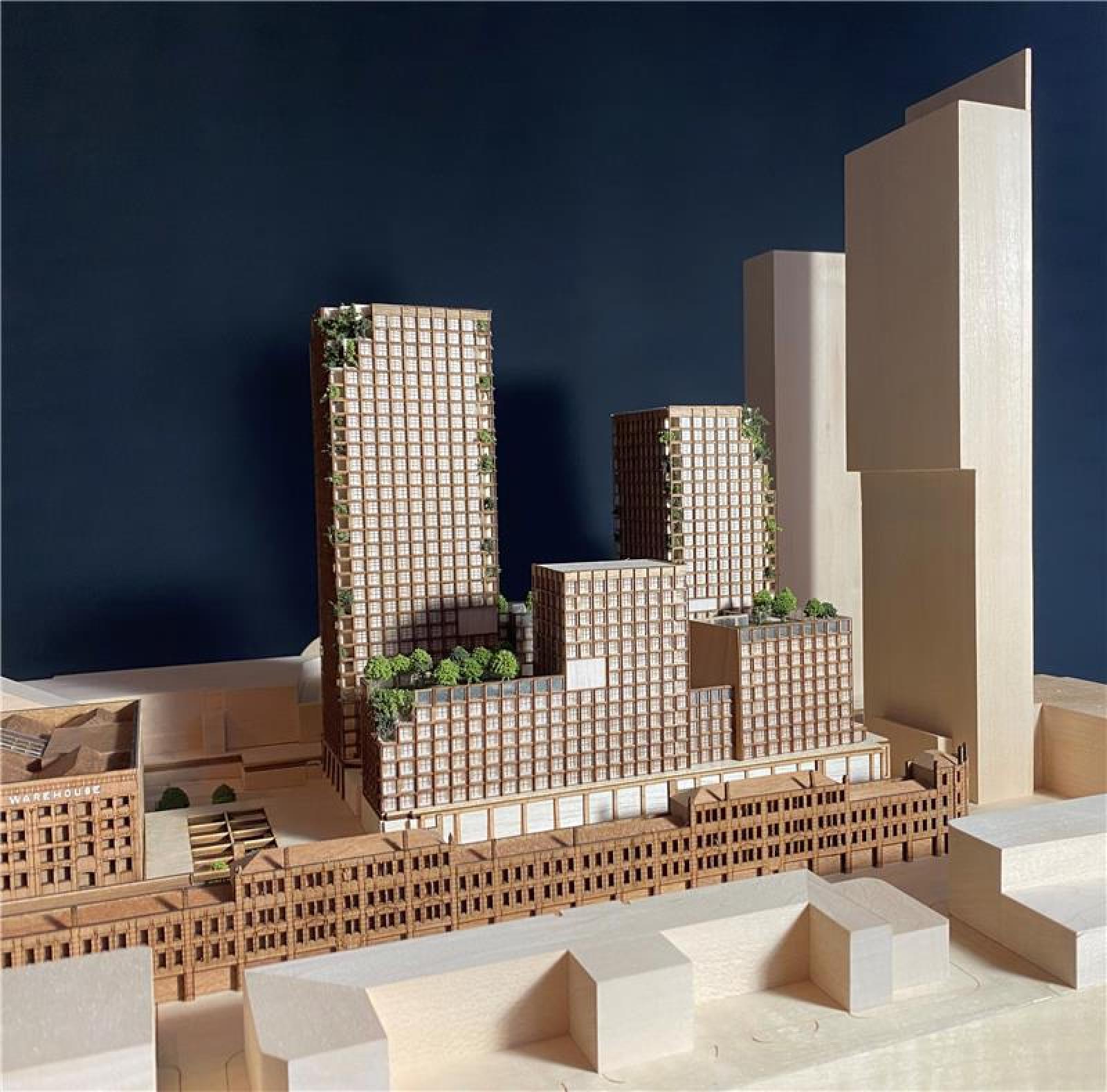 Great Northern, 1:500, Presentation Model

This 1:500 scale model for the mixed-use Great Northern project in Manchester was originally created for display during a public consultation as part of the formal planning process, and has since been used to present the principles of the scheme in many other formal and informal settings, with audiences ranging from funders and investors to potential contractors.

The full site is represented, allowing people to view the proposal in its entirety from every orientation, providing a comprehensive representation of the scheme’s architectural vision and relationship to the surrounding city context.

At the heart of our proposals is the sensitive refurbishment and redevelopment of the Grade II* listed Warehouse and Grade II listed Deansgate Terrace for office, leisure, and retail use. The model clearly communicates how these important historic buildings anchor the development, helping to explain the way in which the proposed new buildings and spaces have been designed to respect and complement their architectural language and established urban presence.

The model is an example of how careful attention to crafted detail can be used to successfully express the fundamental architectural principles and ethos of a design proposal, fostering successful engagement with stakeholders, and helping to create an inclusive design process.

Materials: Obeche Wood, Sapele Wood, Balsa Wood, Acrylic | Techniques: Laser cutting, Traditional handcraft techniques

 Model Maker: Kaia Williams
