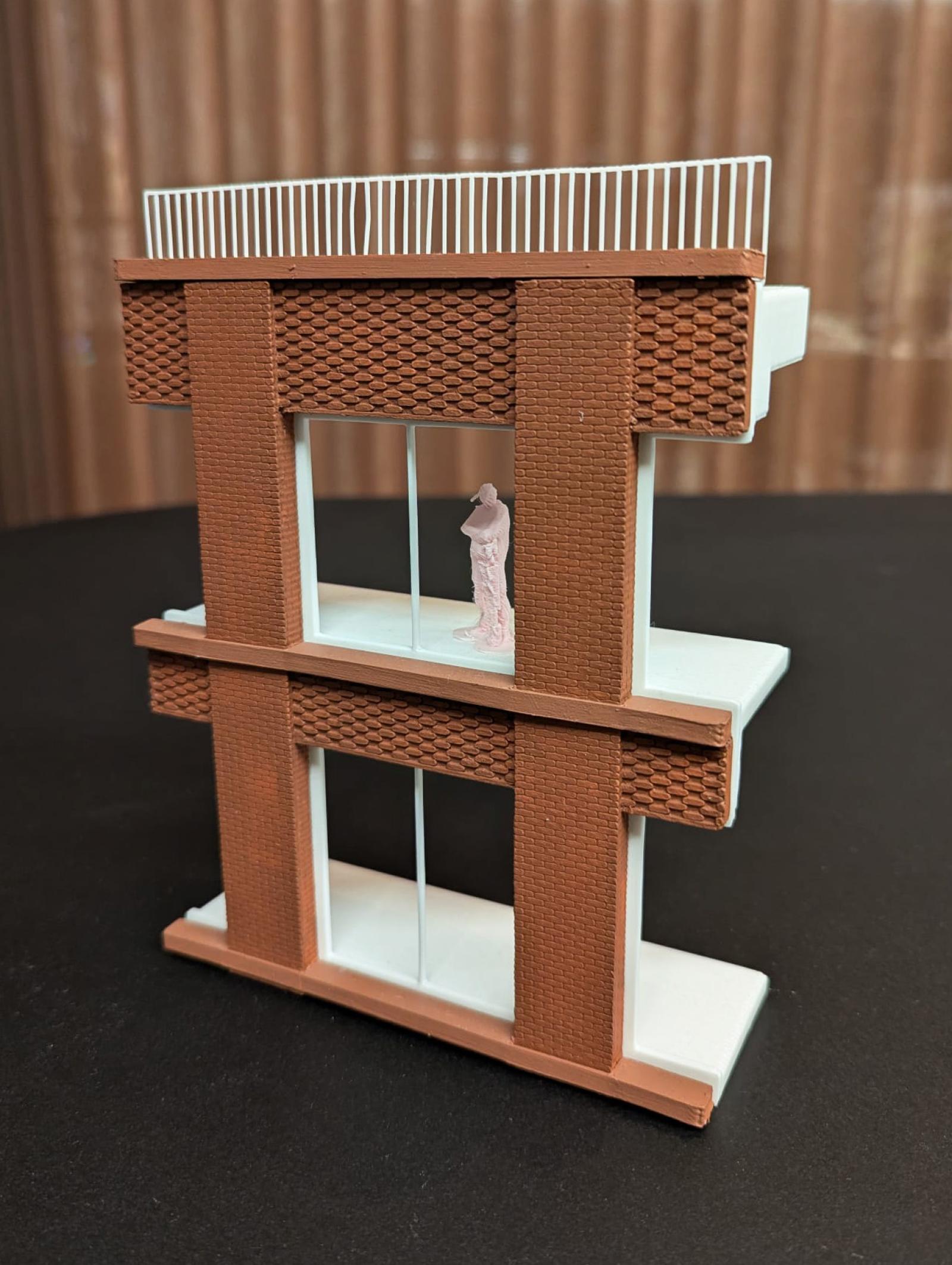 35 Fountain Street, 1:50, Window Bay Study 

This model was used to develop and test the detailed façade design of 35 Fountain Street, focusing on material expression, proportion and façade depth. The use of contrasting colour and texture in the model helps to clarify how different façade elements relate to one another, and the increased scale allows a greater level of detail and a clearer understanding of the look and feel of the façade.  

The model enables a close study of window proportions, facade layering and depth of window reveals, and allows the interaction of light and shadow to be assessed; these qualities were critical in understanding how the façade will be perceived from street level. 

PLA 3D Print

Made by Katy Webb, Architectural Assistant & Sam Gills, Associate
